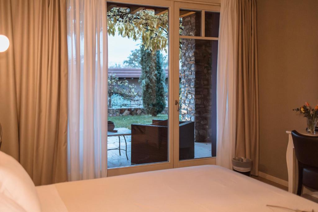 Postel nebo postele na pokoji v ubytování Le Greghe Suites