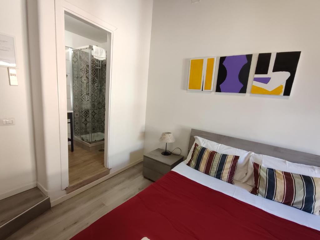 Łóżko lub łóżka w pokoju w obiekcie Giubbonari Street
