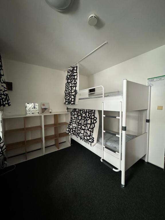 Postel nebo postele na pokoji v ubytování Hostel John Galt