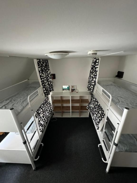 Postel nebo postele na pokoji v ubytování Hostel John Galt