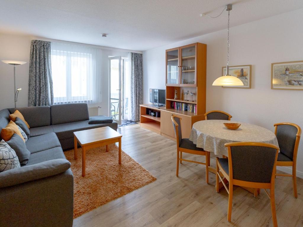 a living room with a couch and a table at Wohnpark Stadt Hamburg - Apt. 27 in Binz