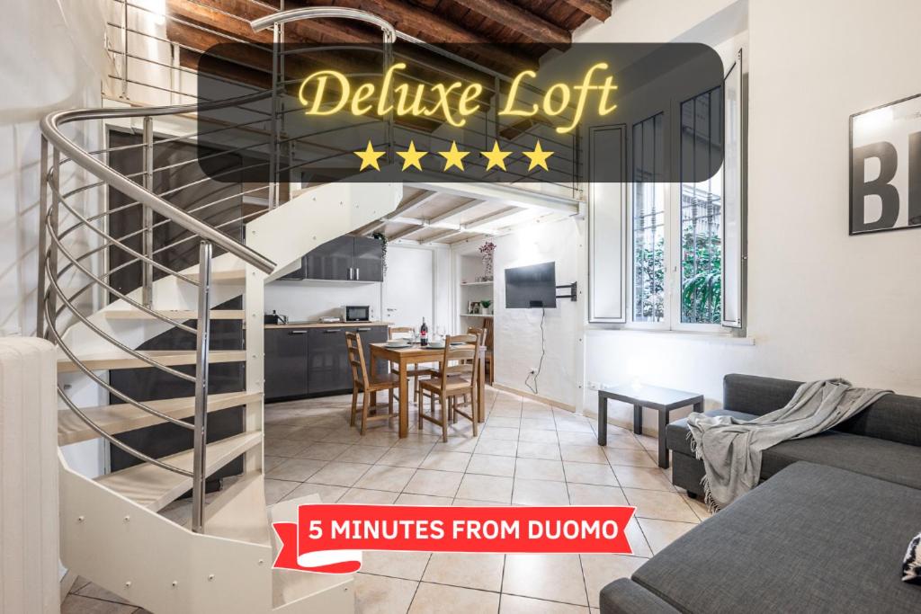uma sala de estar com uma escadaria com detalhes de Duhov em Duomo 10 minutes away - Loft with Wifi and Netflix em Milão
