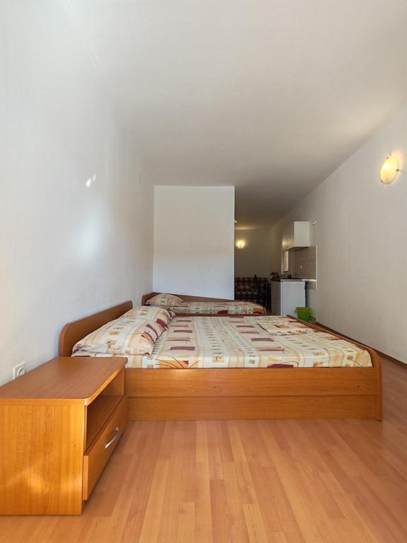 Postel nebo postele na pokoji v ubytování Apartmani i sobe Šagarjelo