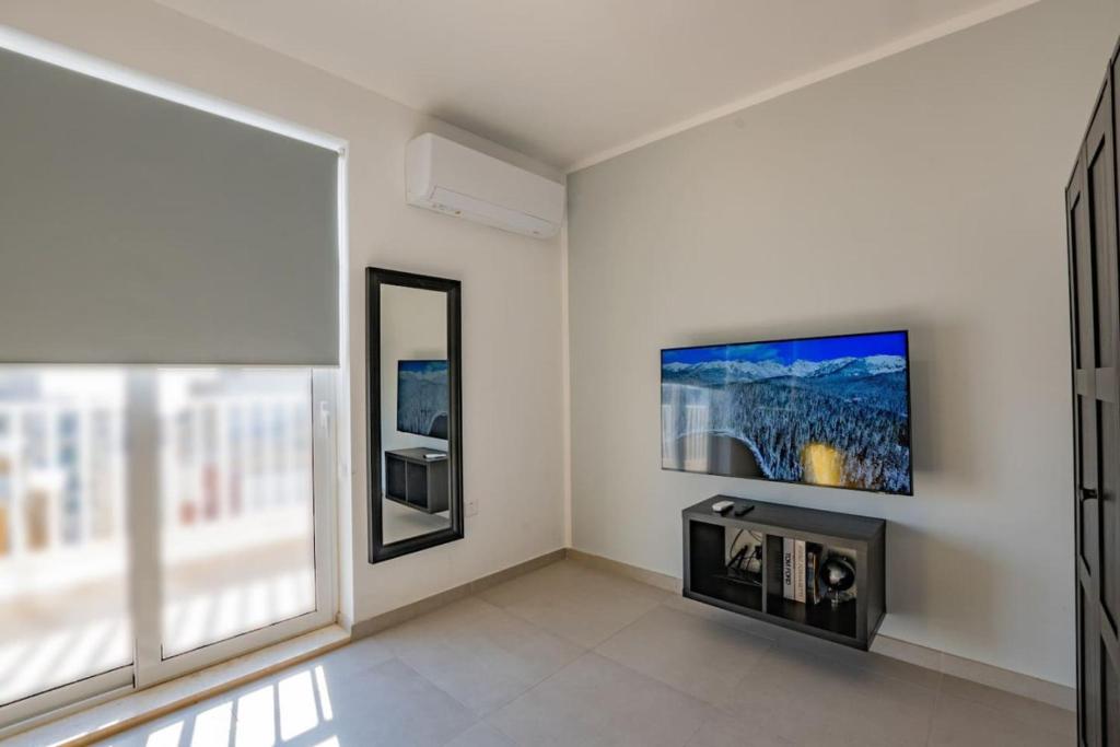 TV a/nebo společenská místnost v ubytování BlissNest