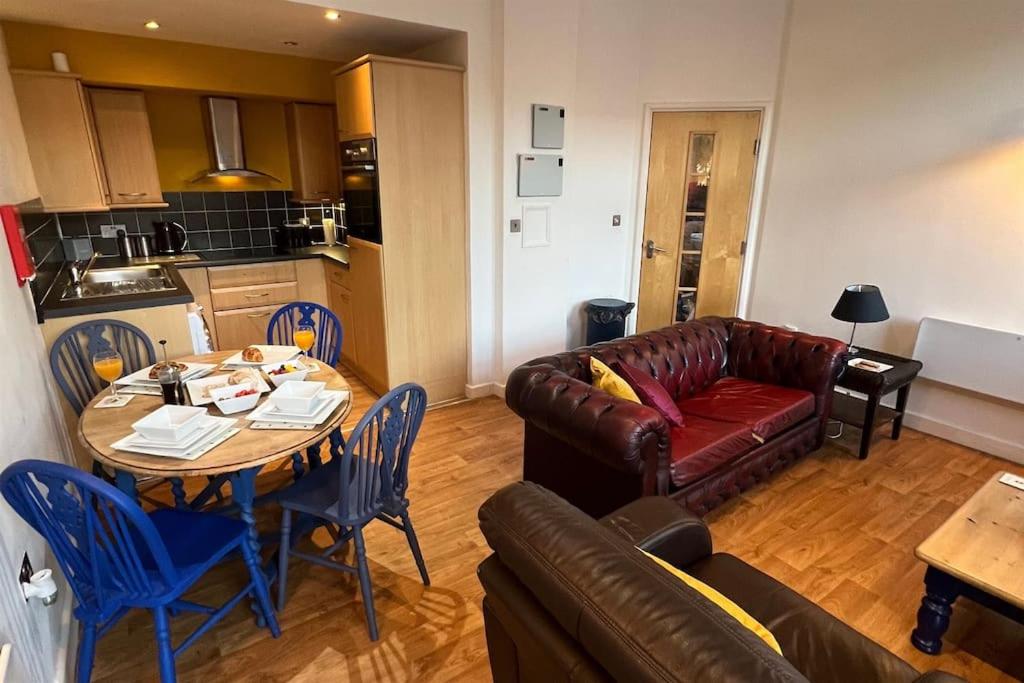 a living room with a couch and a table at Millside Lodge - Easy walk to Shops, Attractions, in Burton upon Trent