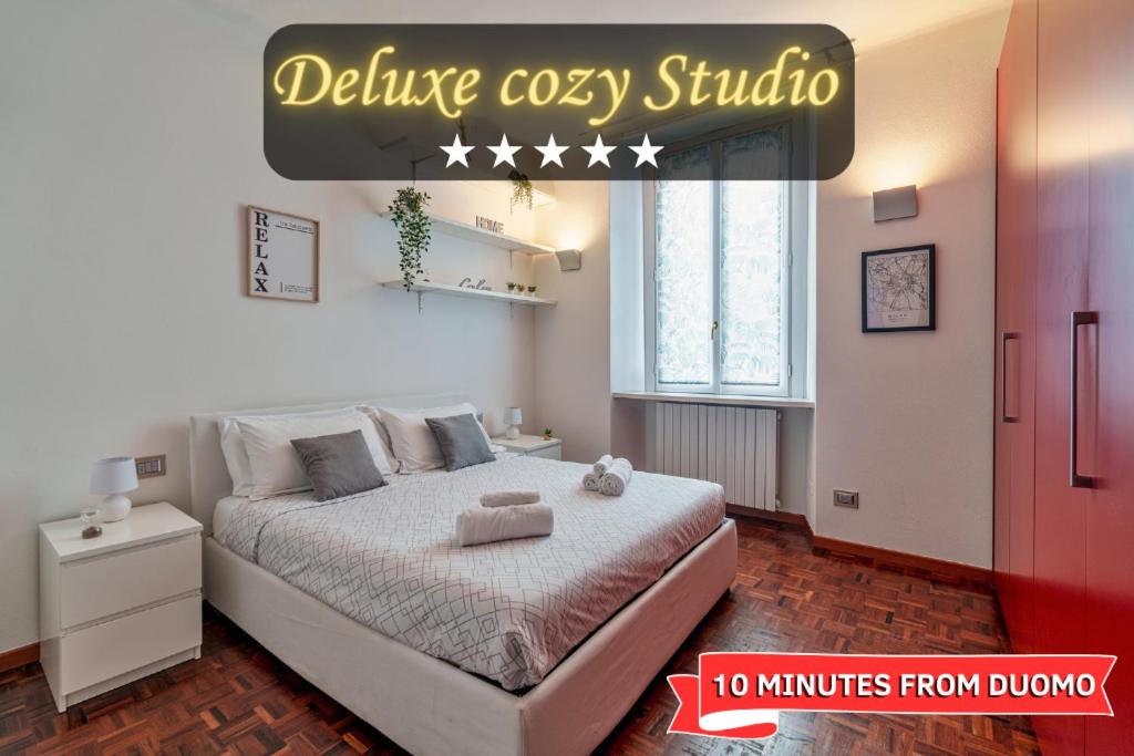 a bedroom with a large bed in a room at [DUOMO-Cadorna] Cozy with WiFi & A/C in Milan