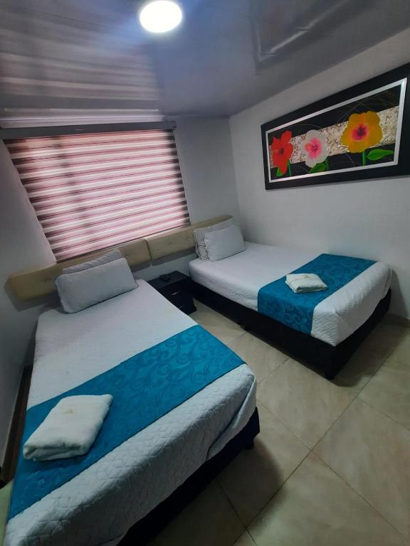 Postel nebo postele na pokoji v ubytování Hotel Zafiro Boutique