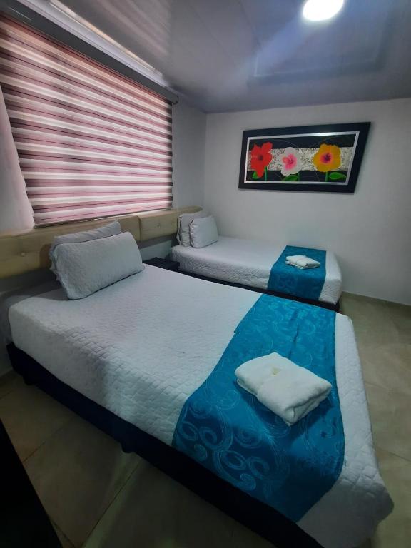 Postel nebo postele na pokoji v ubytování Hotel Zafiro Boutique
