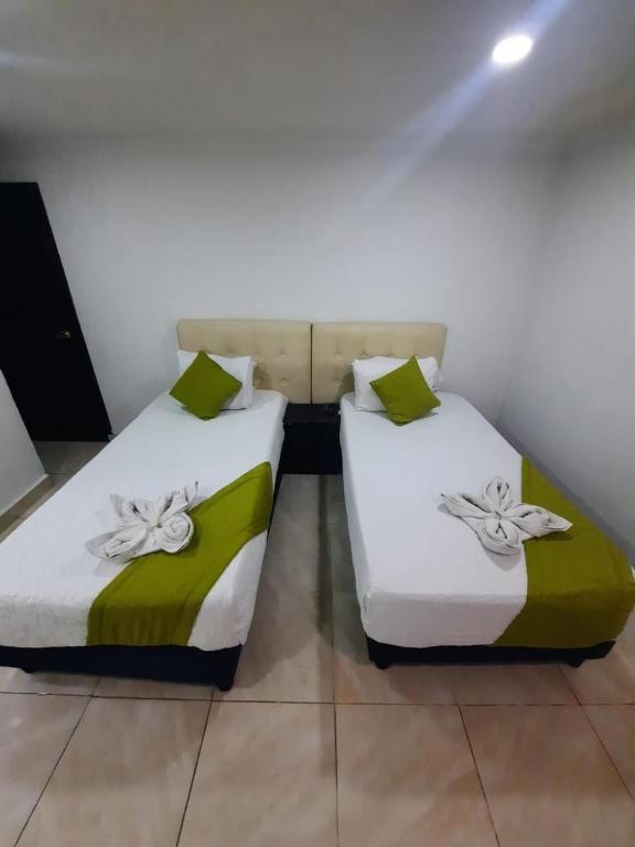 Postel nebo postele na pokoji v ubytování Hotel Zafiro Boutique