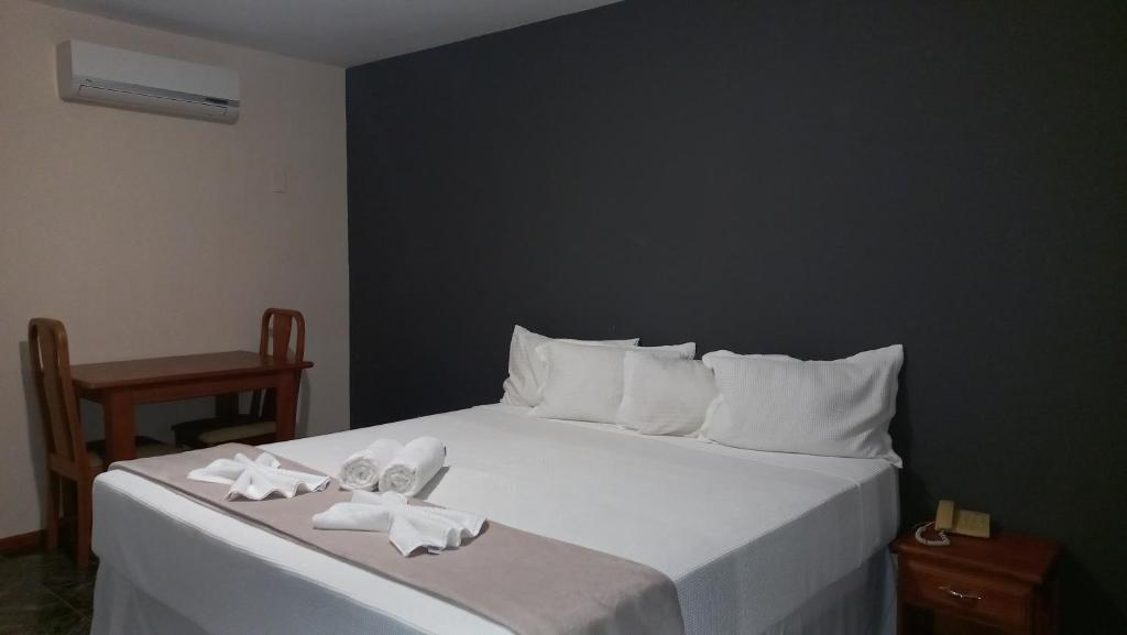 Postel nebo postele na pokoji v ubytování Canzi Cataratas Hotel