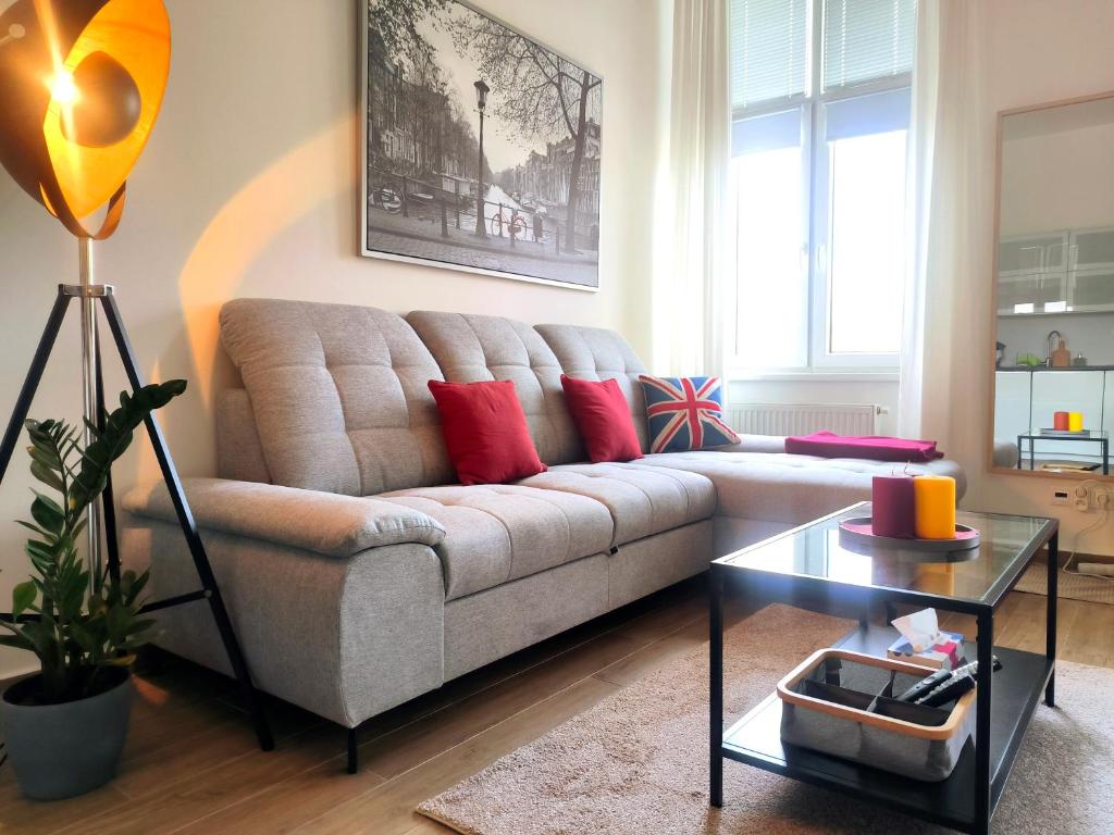 a living room with a couch and a table at CozyHome in Old Town, Presidential apartment in Bratislava