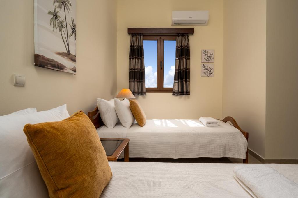 Postel nebo postele na pokoji v ubytování Hermes' Getaway Plimmiri