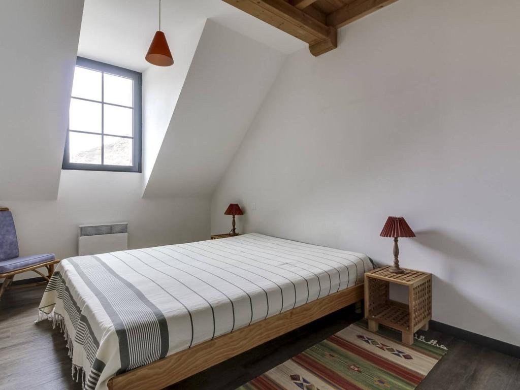 a bedroom with a bed and a window at Appartement Barèges, 4 pièces, 9 personnes - FR-1-403-64 in Barèges