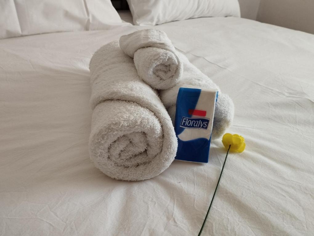 a towel animal is laying on a bed at Roma27 Scarperia in Scarperia