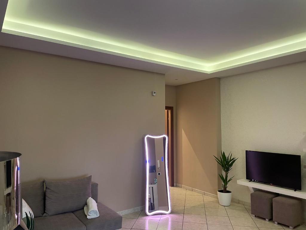 TV a/nebo společenská místnost v ubytování Pompei Home Apartament