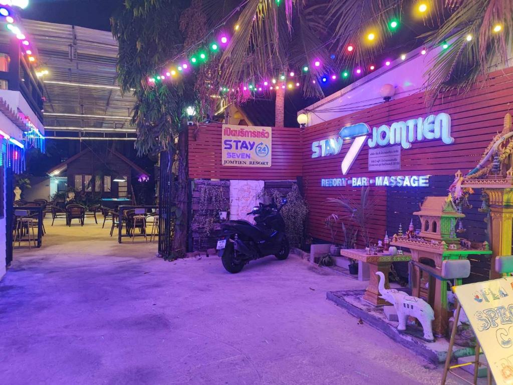 a motorcycle parked inside of a building with lights at Stay 7 Jomtien Resort in Jomtien Beach