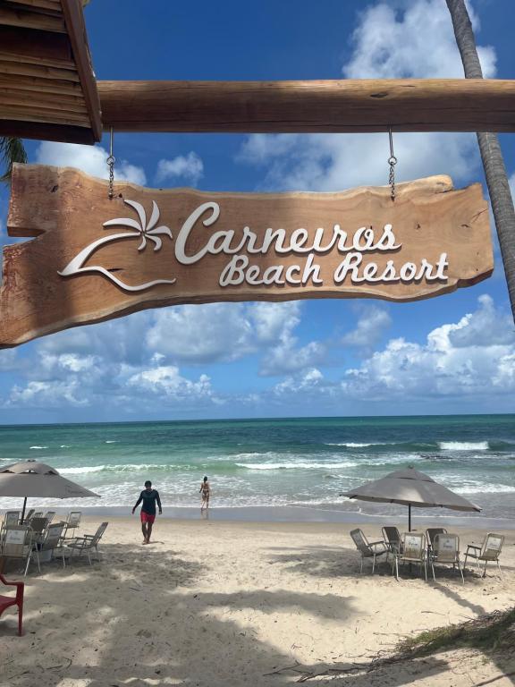 um sinal para a praia em Canamotos à beira-mar em Carneiros Beach Resort - Flat 205-A em Praia dos Carneiros