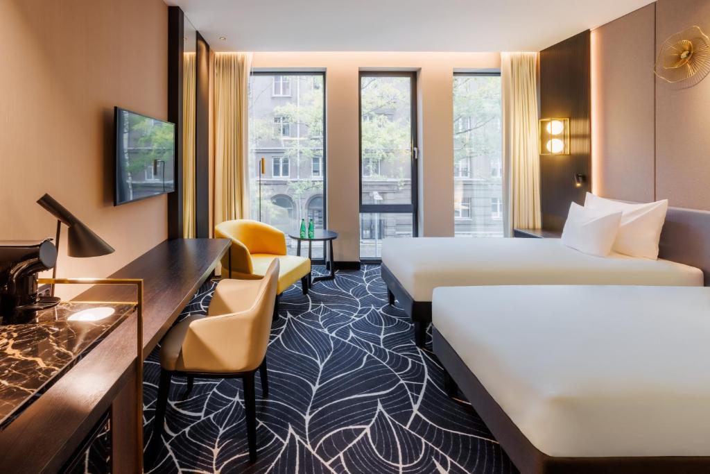 Voodi või voodid majutusasutuse Movenpick Hotel Tallinn toas