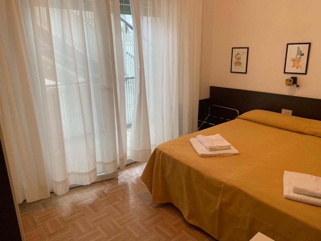 Postel nebo postele na pokoji v ubytování Hotel Aspe
