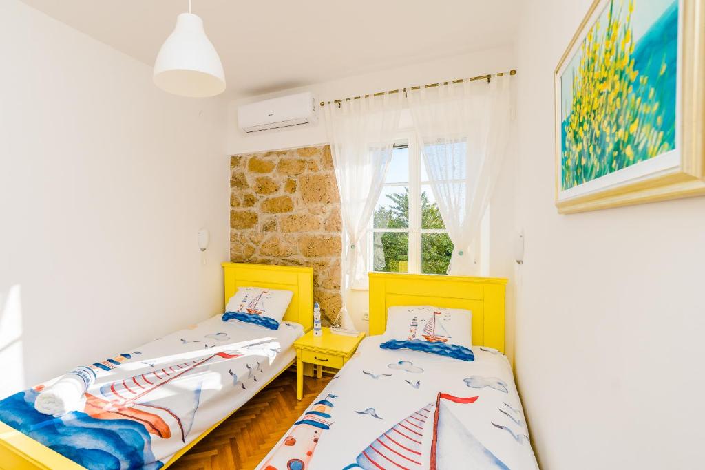 Postel nebo postele na pokoji v ubytování House for rent "Figurica" Lun