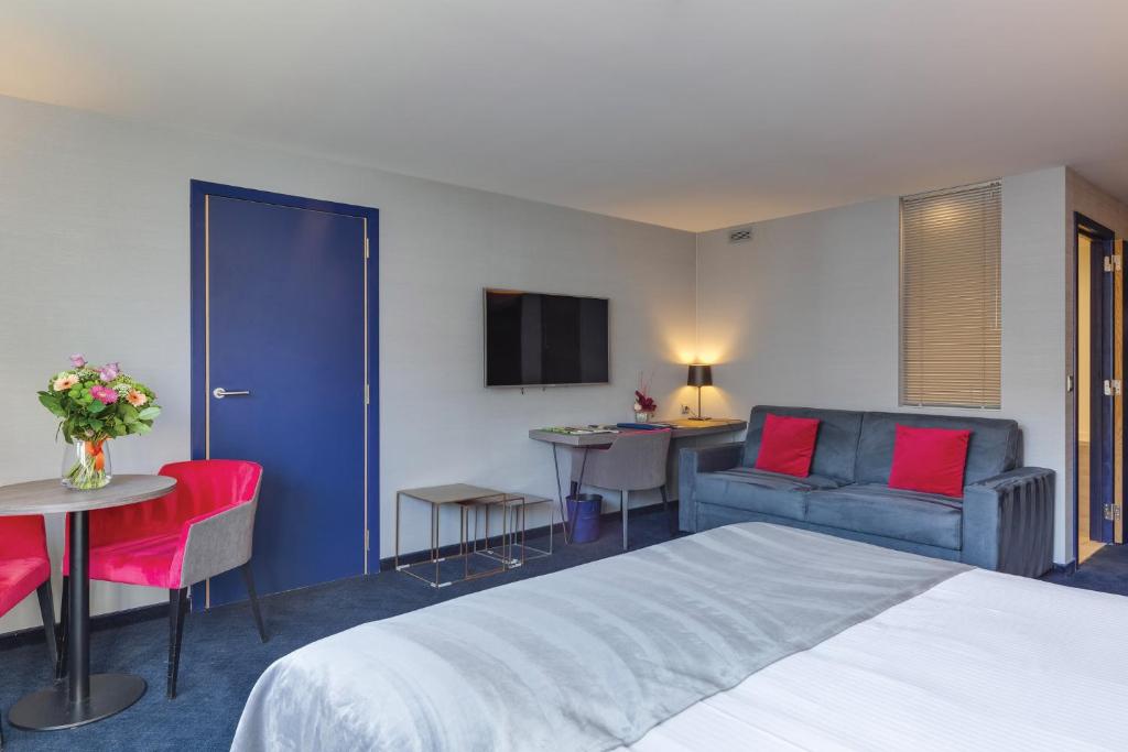 Postel nebo postele na pokoji v ubytování Van der Valk Hotel Liège Congres