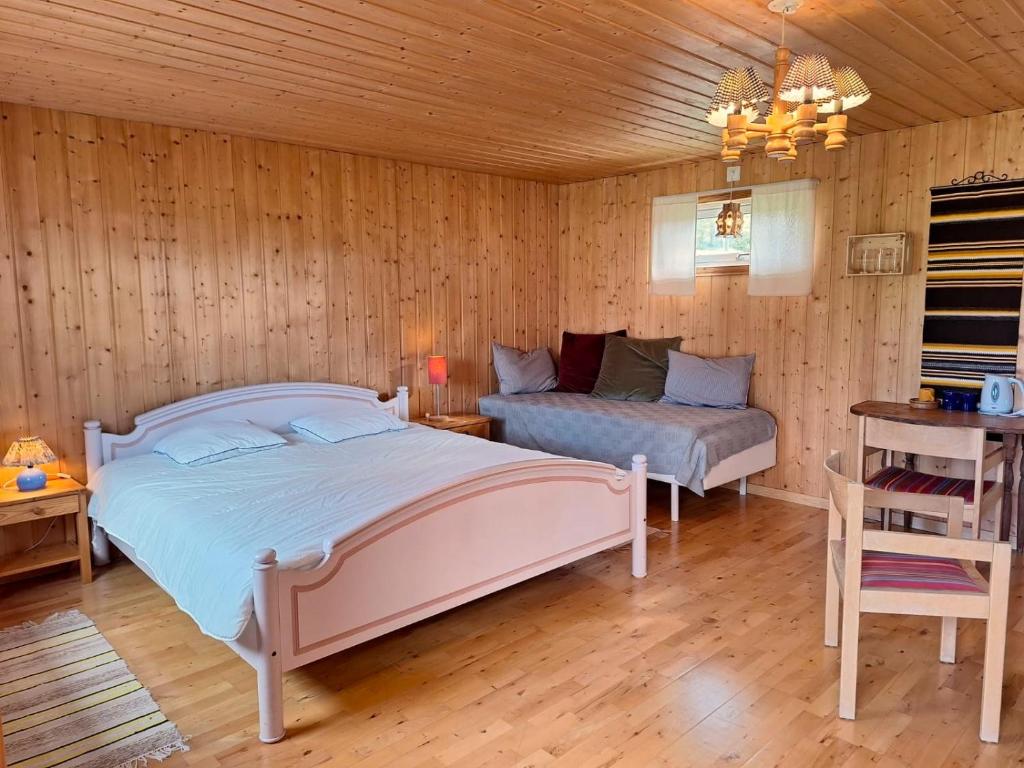 Postel nebo postele na pokoji v ubytování Sam Arctic