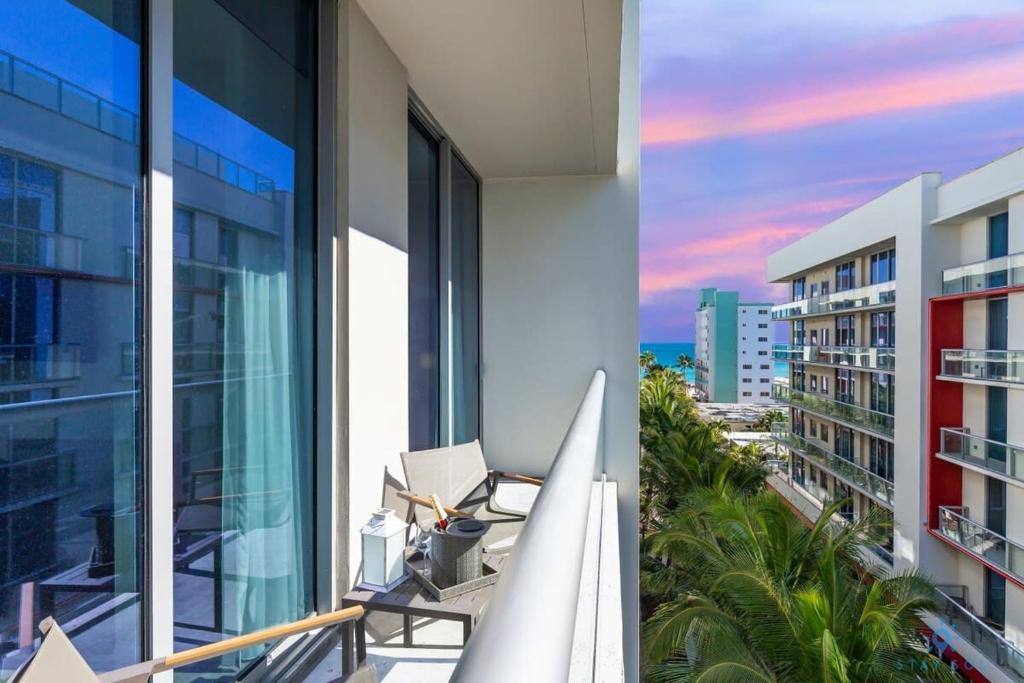 an apartment balcony with a view of the ocean at Perfect Relax - Hollywood Beach - Amazing Pool in Hollywood