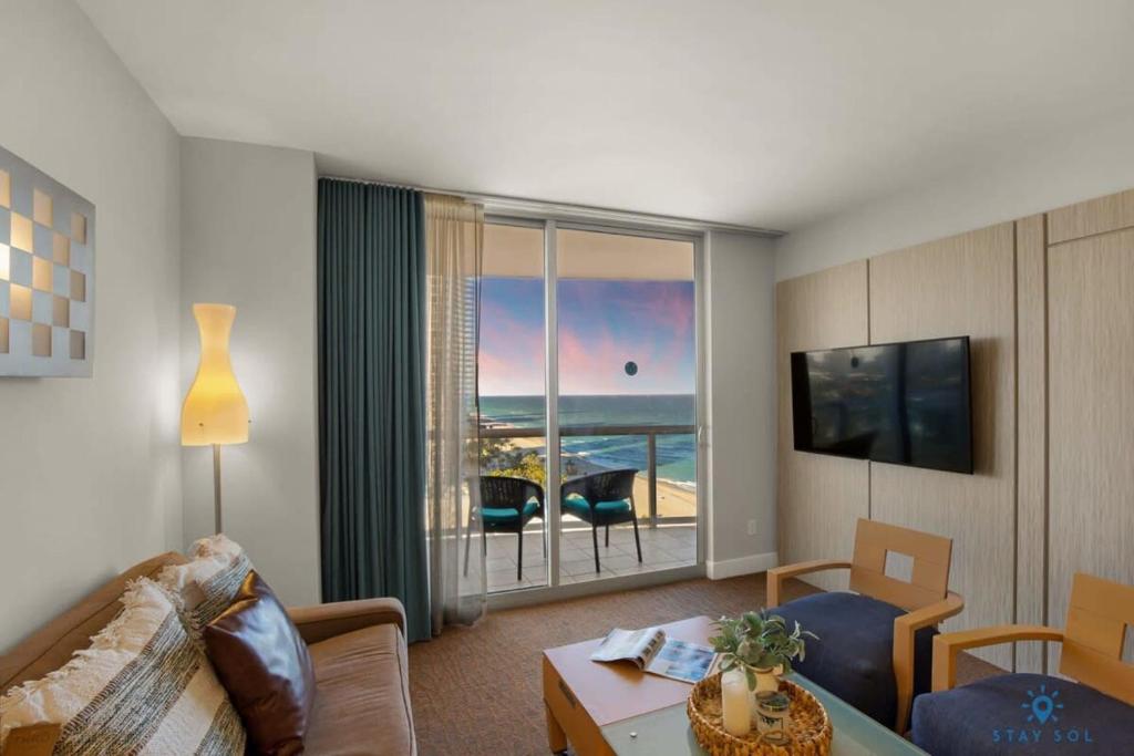 a living room with a view of the ocean at New Sunny Isles Retreat: Oceanview Comfort in Aventura