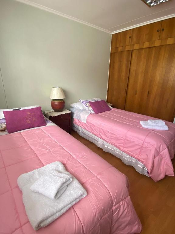 Una cama o camas en una habitación de Karol Hostal
