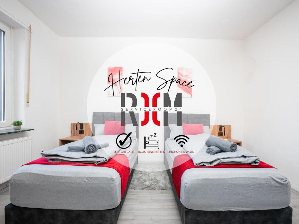 two beds in a room with a sign that says happy spacedn at SR24 - Space in Herten West in Herten