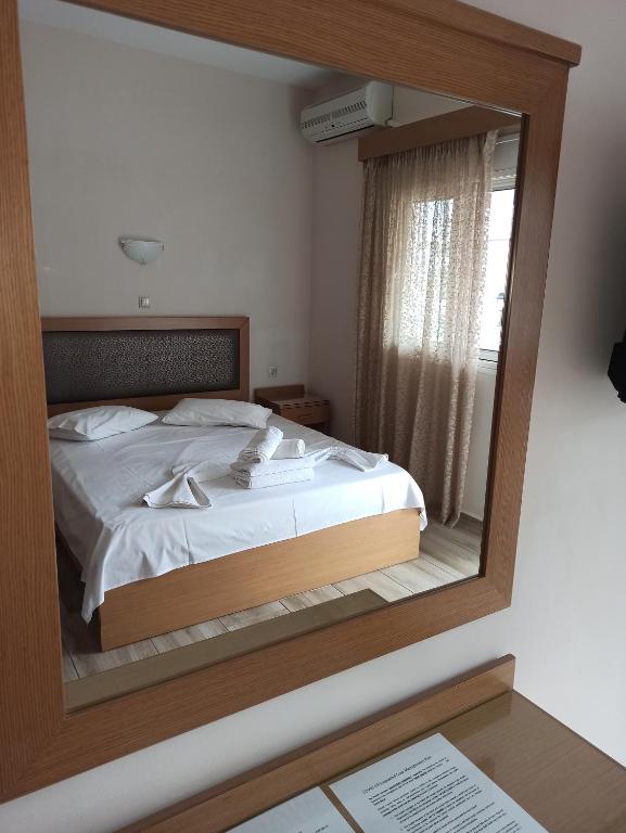 Postel nebo postele na pokoji v ubytování VILLA ANESTIS