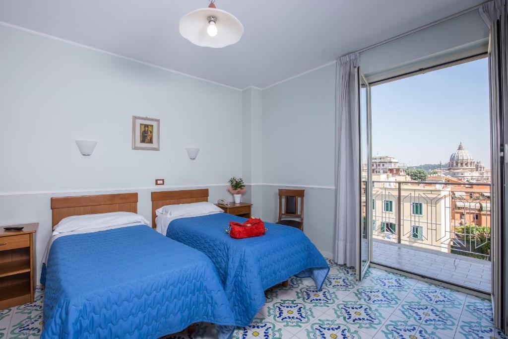 Postel nebo postele na pokoji v ubytování Hotel Casa Tra Noi