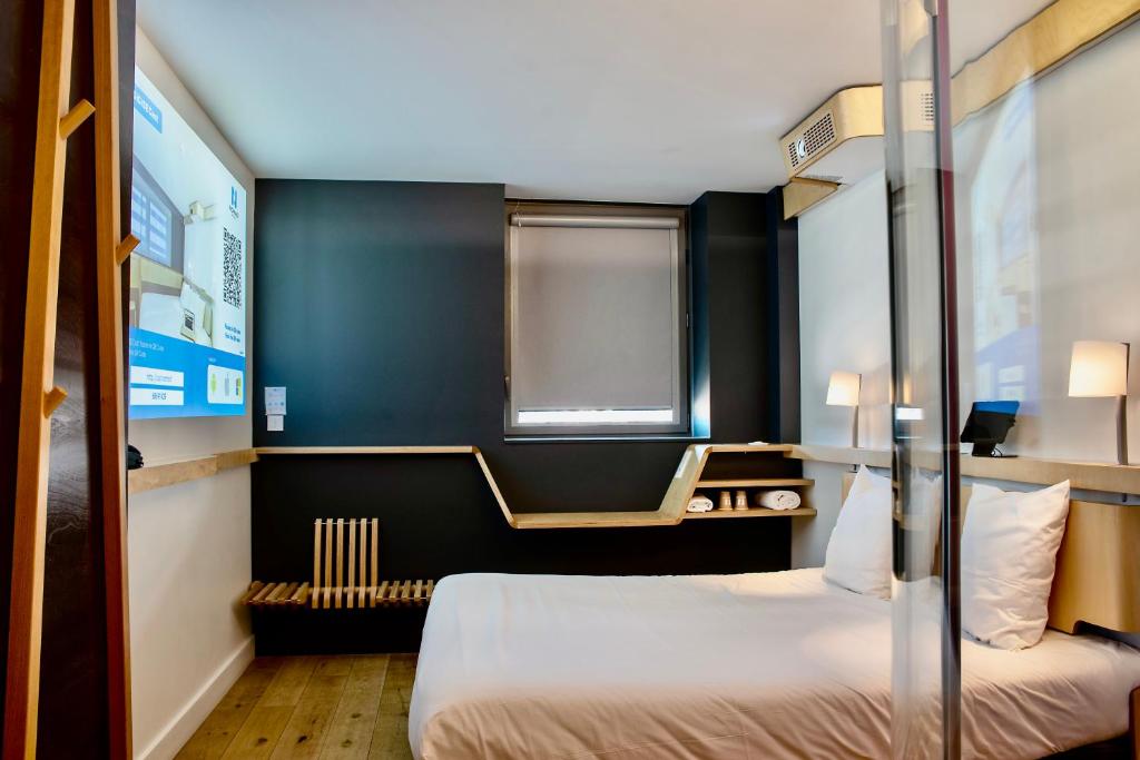 Postel nebo postele na pokoji v ubytování Nomad Hotel Dijon