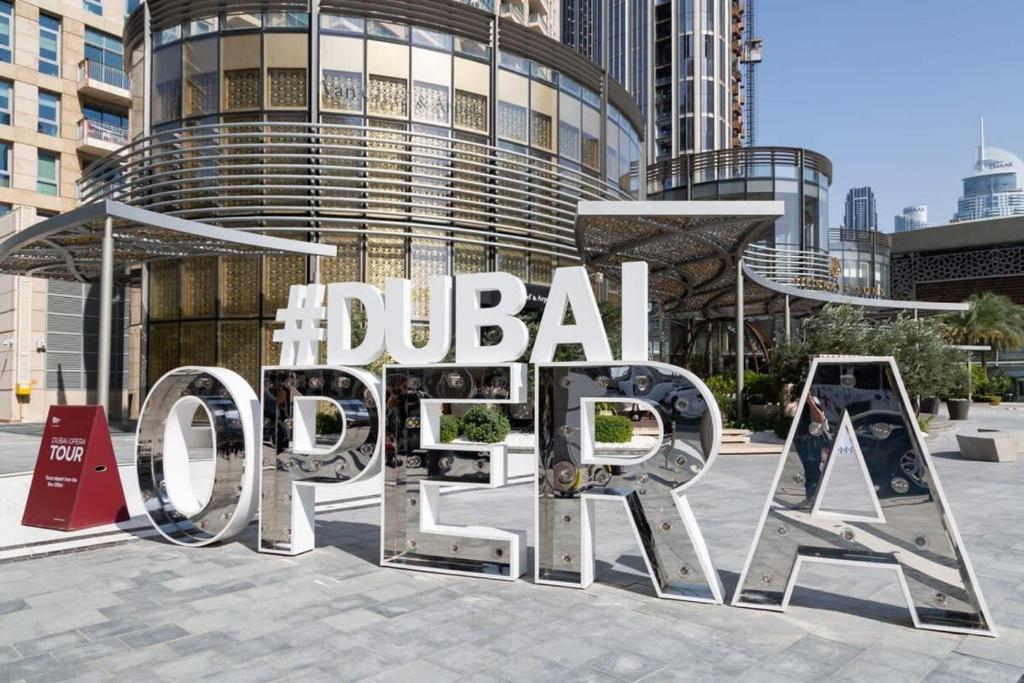 a large metal sign in front of a building at Frank Porter - BLVD Heights T1 in Dubai