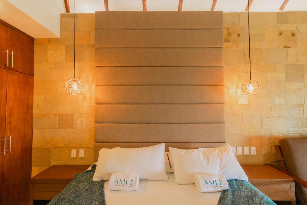 Postel nebo postele na pokoji v ubytování Mayan Playa Bacalar