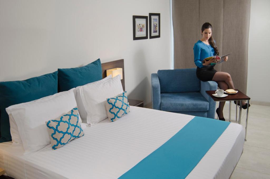 Postel nebo postele na pokoji v ubytování Hotel CasaBlanca Cucuta