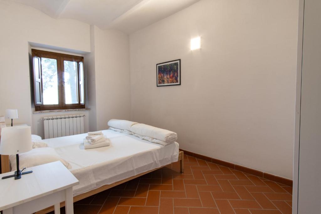 Postel nebo postele na pokoji v ubytování Borgo Gatteraia