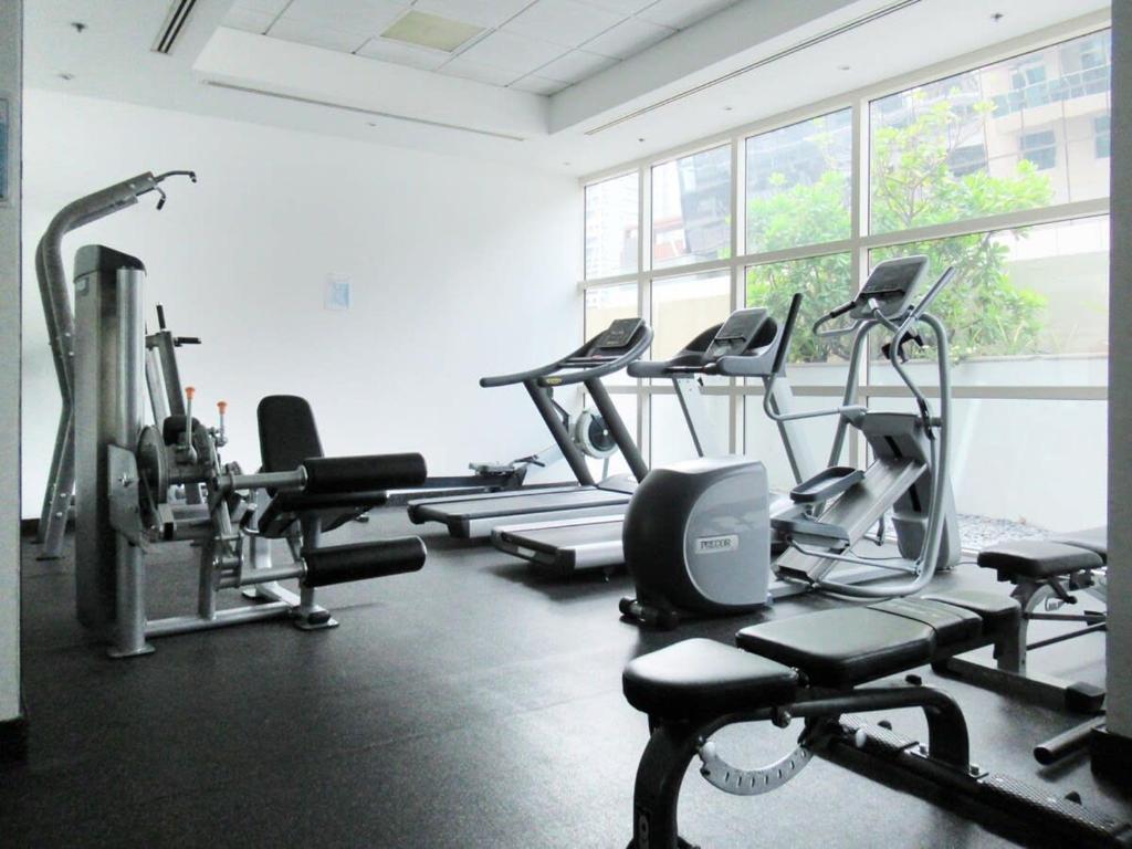 a gym with several treadmills and cardio machines at Frank Porter - Yacht Bay in Dubai