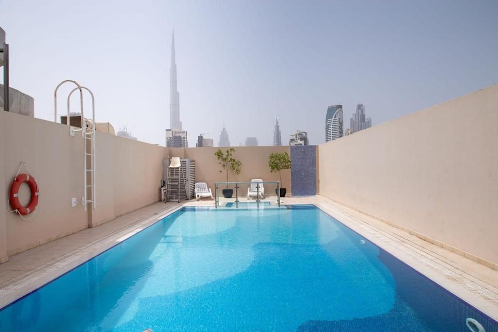 a large swimming pool on top of a building at Frank Porter - Mayfair Residency in Dubai