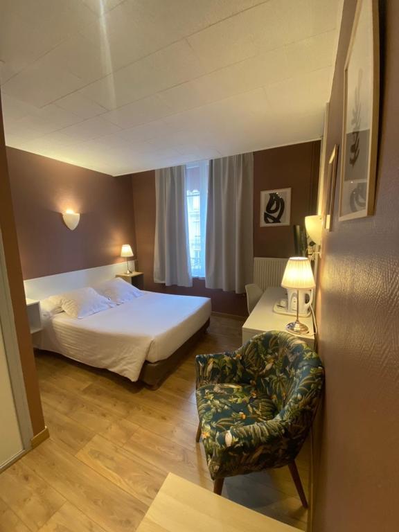 Postel nebo postele na pokoji v ubytování Hotel Le Pelican