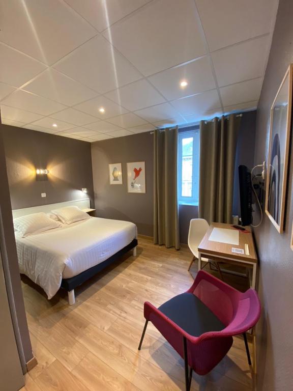 Postel nebo postele na pokoji v ubytování Hotel Le Pelican