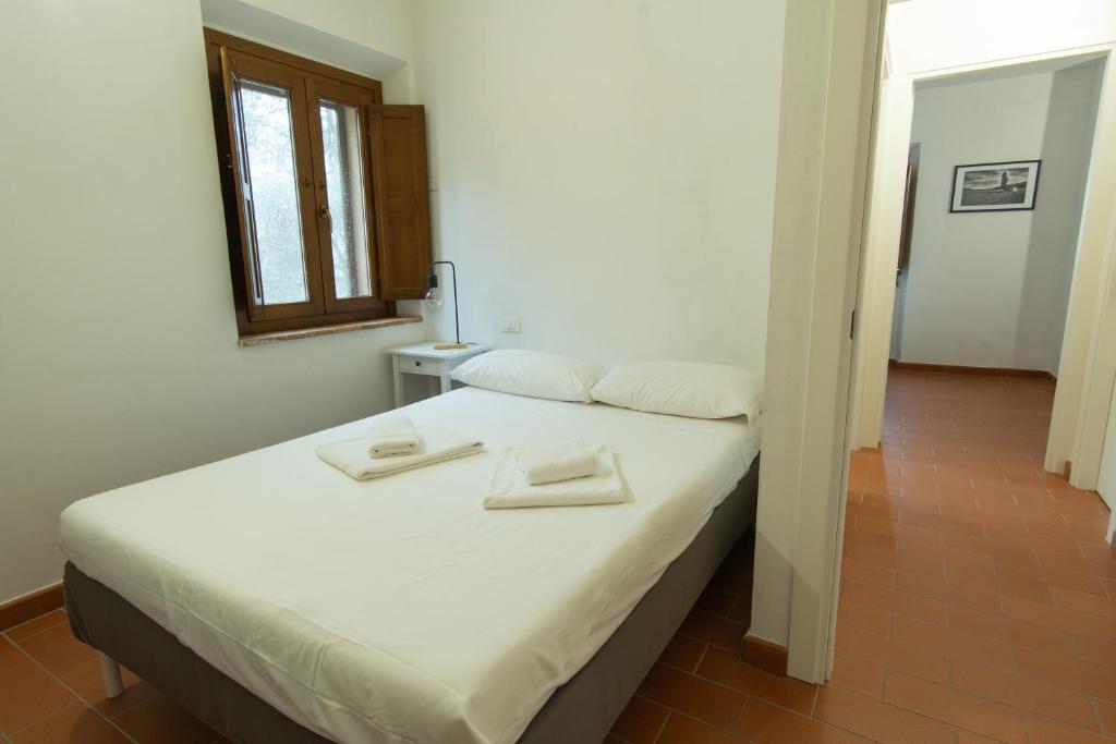Postel nebo postele na pokoji v ubytování Borgo Gatteraia
