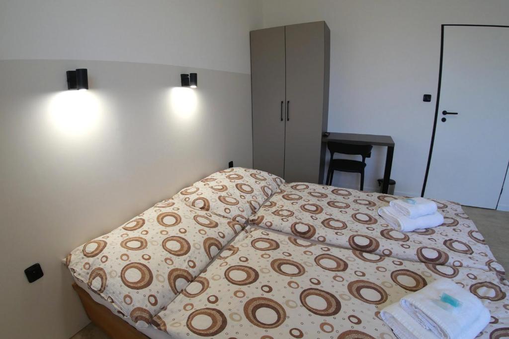 Postel nebo postele na pokoji v ubytování Penzion Tenis Klub DEZA