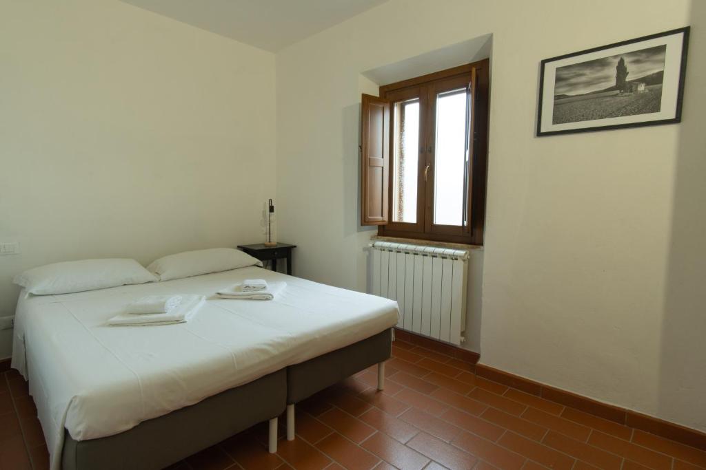 Postel nebo postele na pokoji v ubytování Borgo Gatteraia