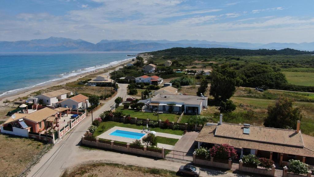 an aerial view of a home next to the beach at Almyra Beach House Corfu in Almiros Beach