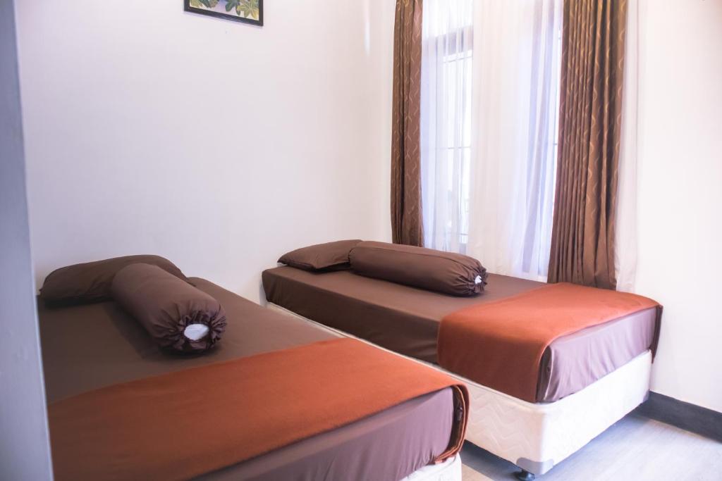 Postel nebo postele na pokoji v ubytování KAZAIN HOTEL