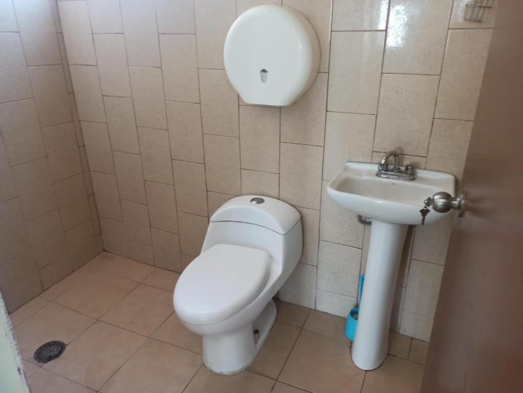 a bathroom with a toilet and a sink at oaxaca in Oaxaca City
