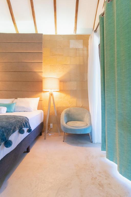 Postel nebo postele na pokoji v ubytování Mayan Playa Bacalar