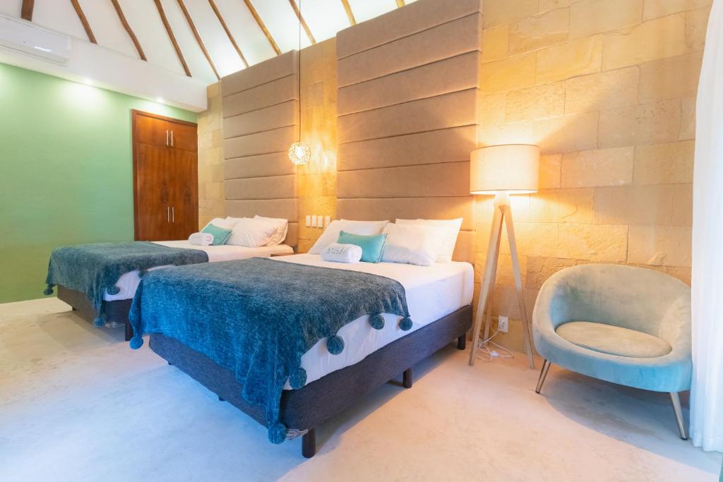Postel nebo postele na pokoji v ubytování Mayan Playa Bacalar