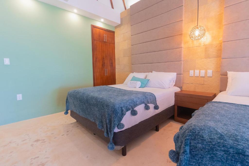 Postel nebo postele na pokoji v ubytování Mayan Playa Bacalar